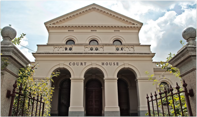Photograph of a court house entrance.