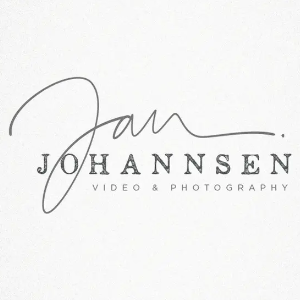 logo by Cit - multi-font logo of Jan Johanssen, first name is handwritten with a long signature-like stroke, second name uses a classic serif font, all in a grainy and slightly washed-out black
