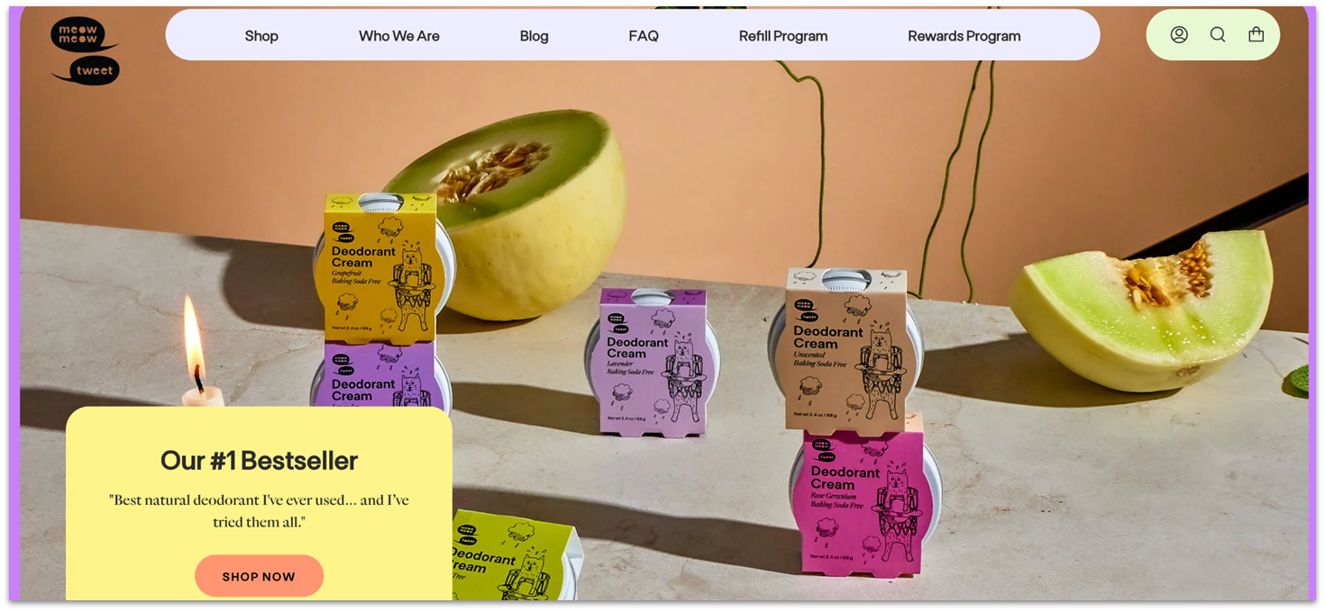 Meow Meow Tweet's homepage showing purple, yellow, and green deodorant products.